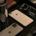 silver iphone 6 beside silver macbook and black framed eyeglasses
