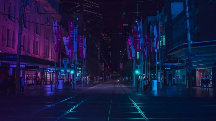 people walking on walkway during nighttime