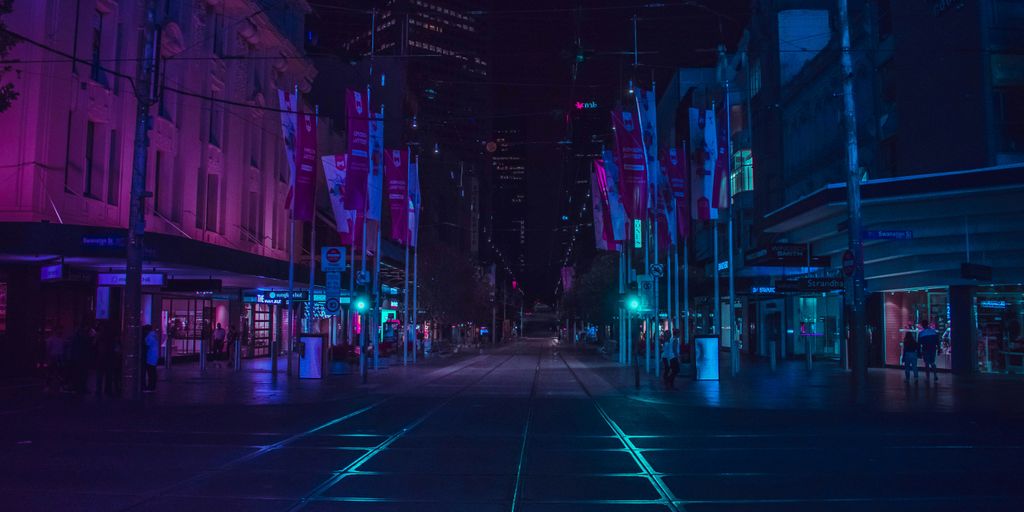 people walking on walkway during nighttime