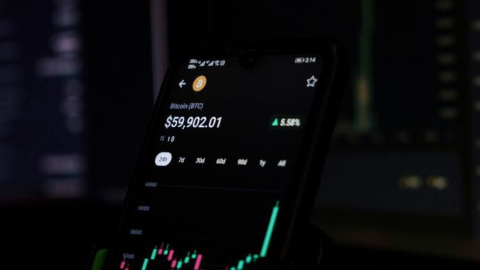 a cell phone displaying a stock chart on the screen