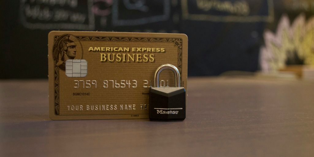 closeup photo of American Express Business card on brown surface