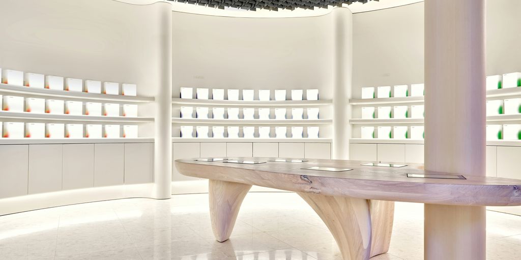 a bench in a room with a lot of shelves