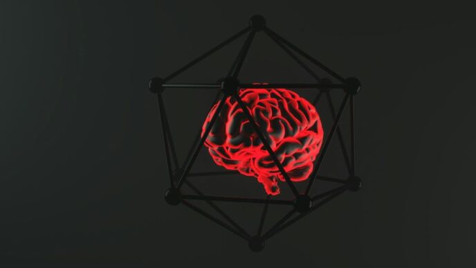 Glowing brain encased in a geometric structure.