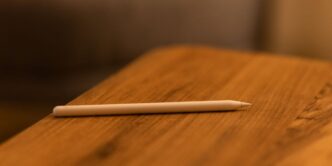 white pen on brown wooden table