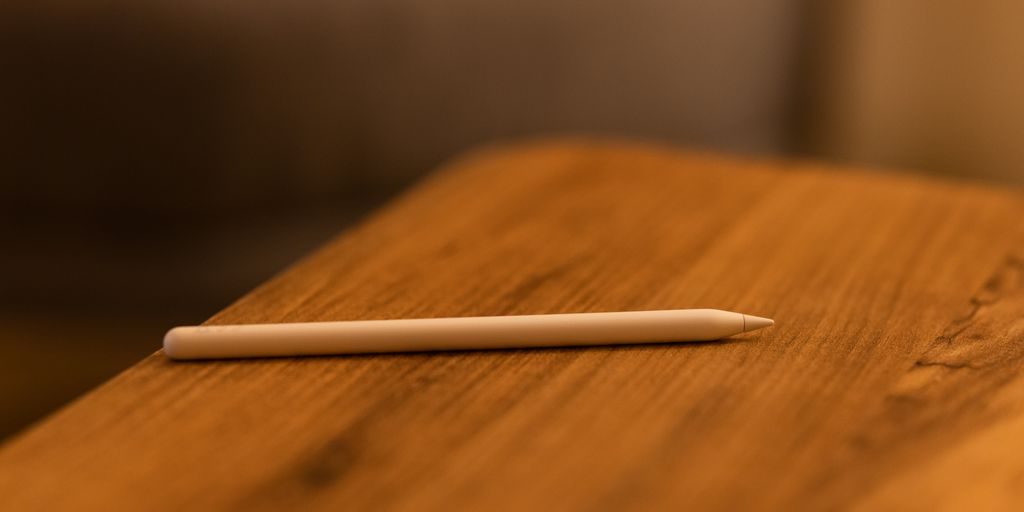 white pen on brown wooden table