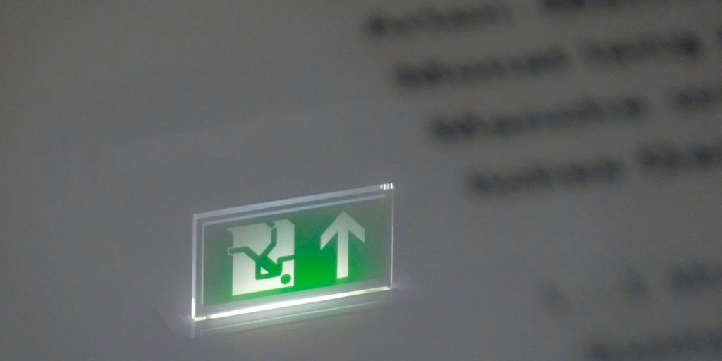 white and green letter x sign