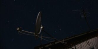 A satellite dish sitting on top of a roof