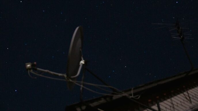 A satellite dish sitting on top of a roof