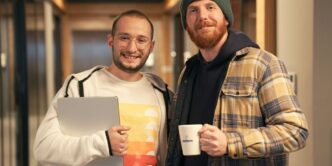 a couple of men standing next to each other