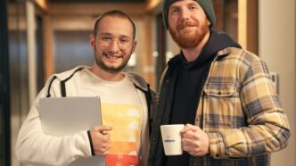 a couple of men standing next to each other