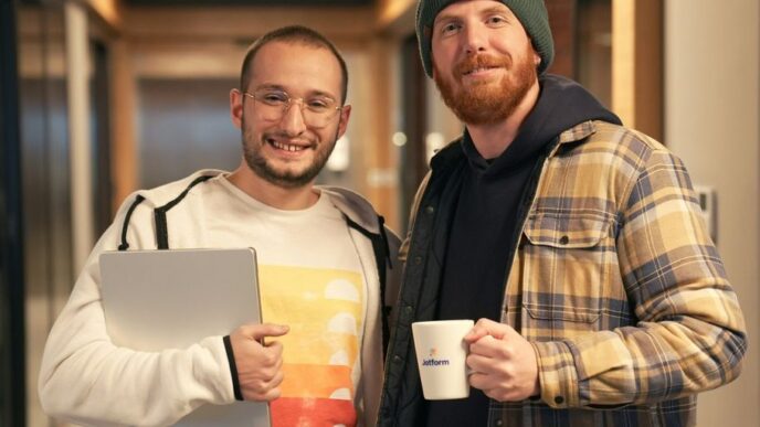a couple of men standing next to each other