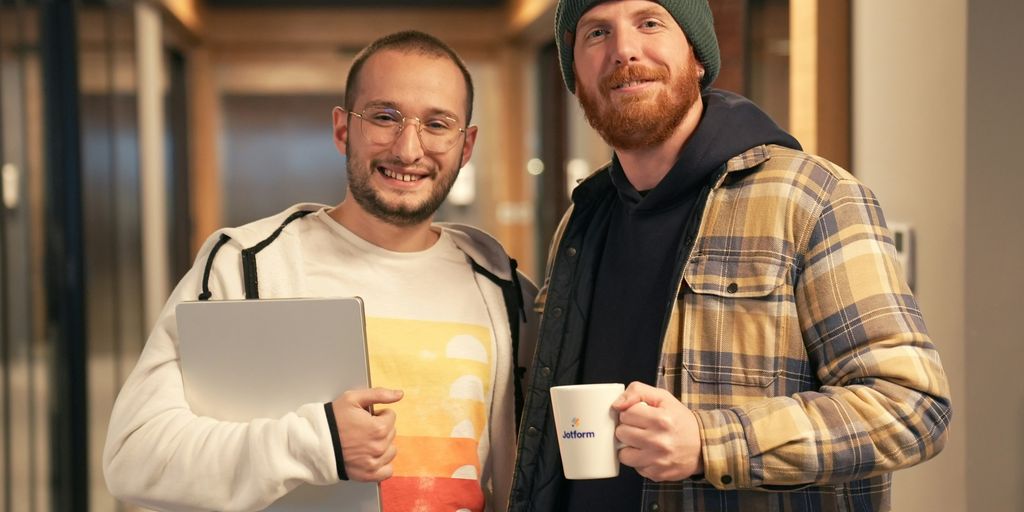 a couple of men standing next to each other