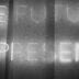 a black and white photo of a blackboard with writing on it
