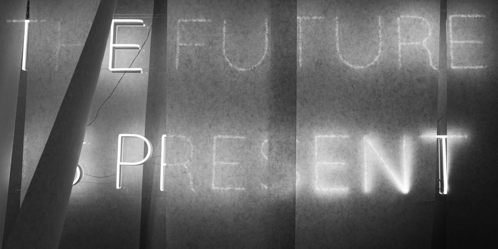 a black and white photo of a blackboard with writing on it