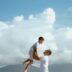 a man is holding a young boy on his shoulders