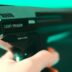 person holding black light phaser