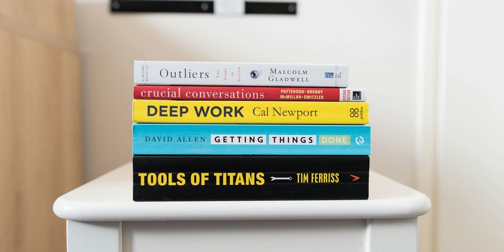 several books on top of table inside room