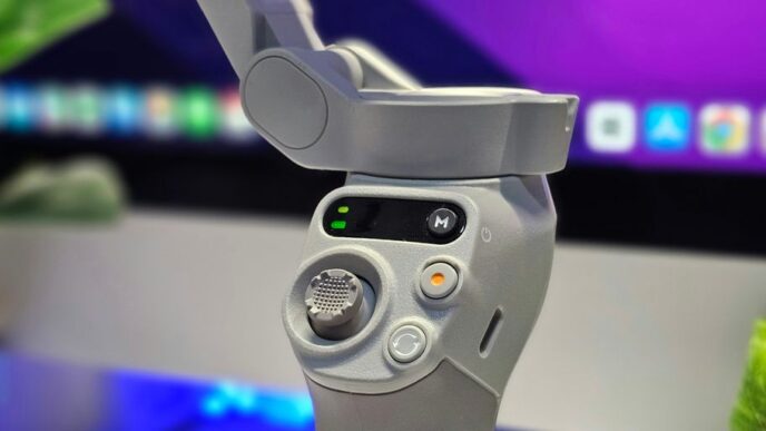 A close up of a video game controller in front of a computer