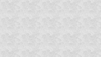 a white textured wallpaper with circles on it