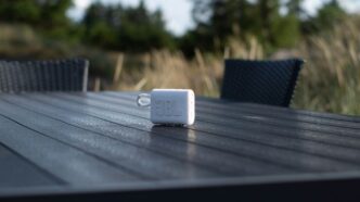 an electronic device sitting on top of a wooden table