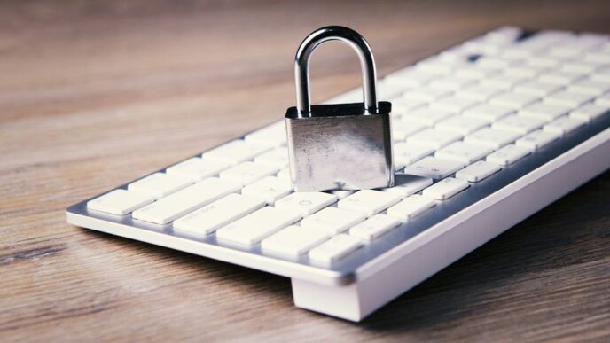 a computer keyboard with a padlock on top of it