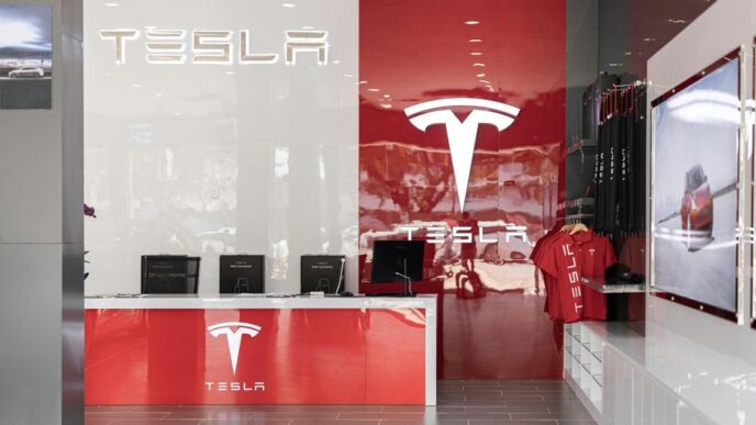 a tesla store with a red and white wall