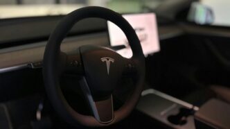 A tesla's steering wheel and interior.