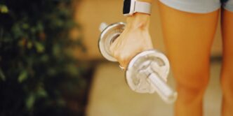a close up of a person holding a water bottle