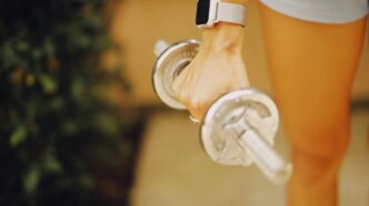 a close up of a person holding a water bottle