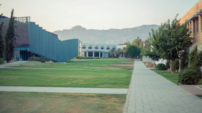 a courtyard with a building and trees