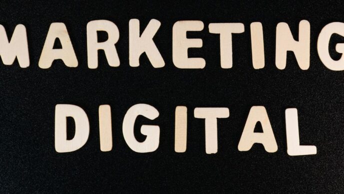 the words marketing and digital written on a black surface
