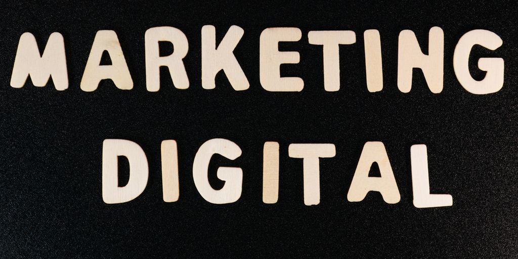 the words marketing and digital written on a black surface