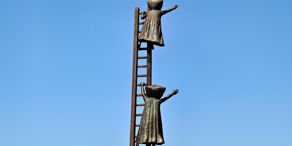 Statues of people climb a ladder to the sky.