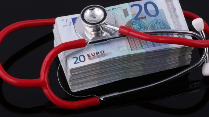 a stethoscope on top of a pile of euro bills