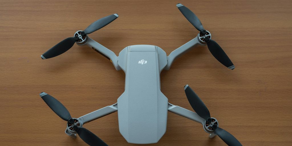 white and gray quadcopter drone