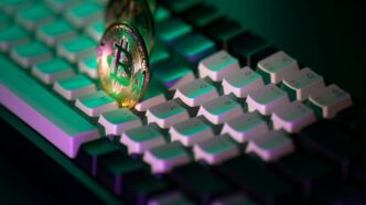 A close up of a computer keyboard with a light on it