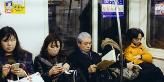five person sitting inside train