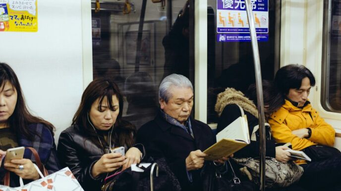 five person sitting inside train