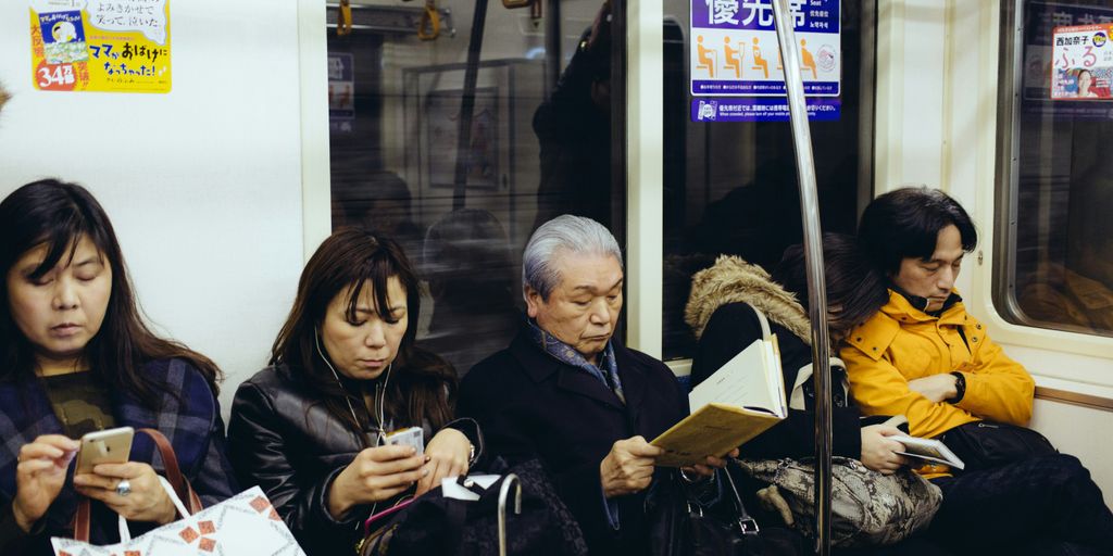 five person sitting inside train