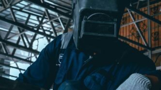 a man wearing a gas mask and gloves