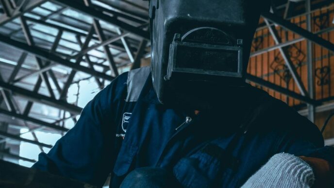 a man wearing a gas mask and gloves