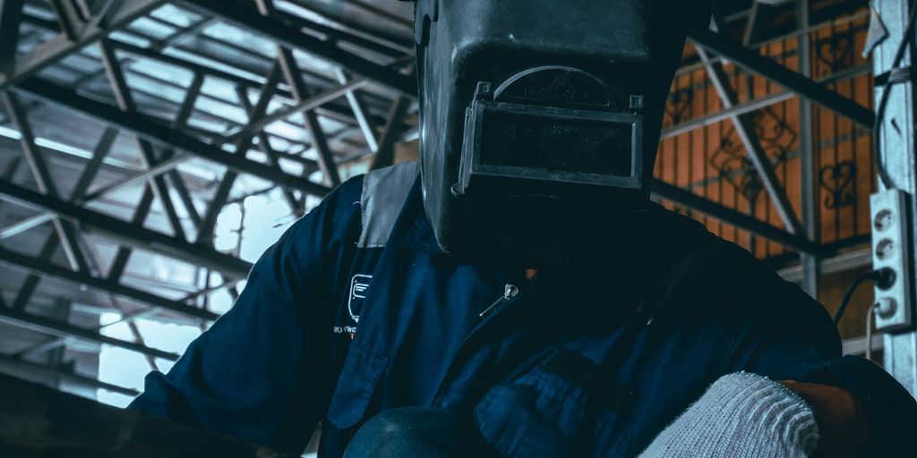 a man wearing a gas mask and gloves