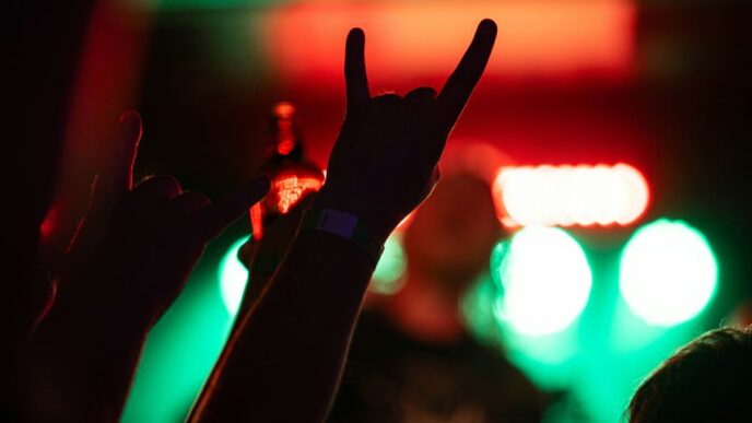 a group of people raising their hands in the air