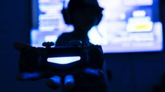 silhouette of man holding camera