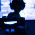 silhouette of man holding camera