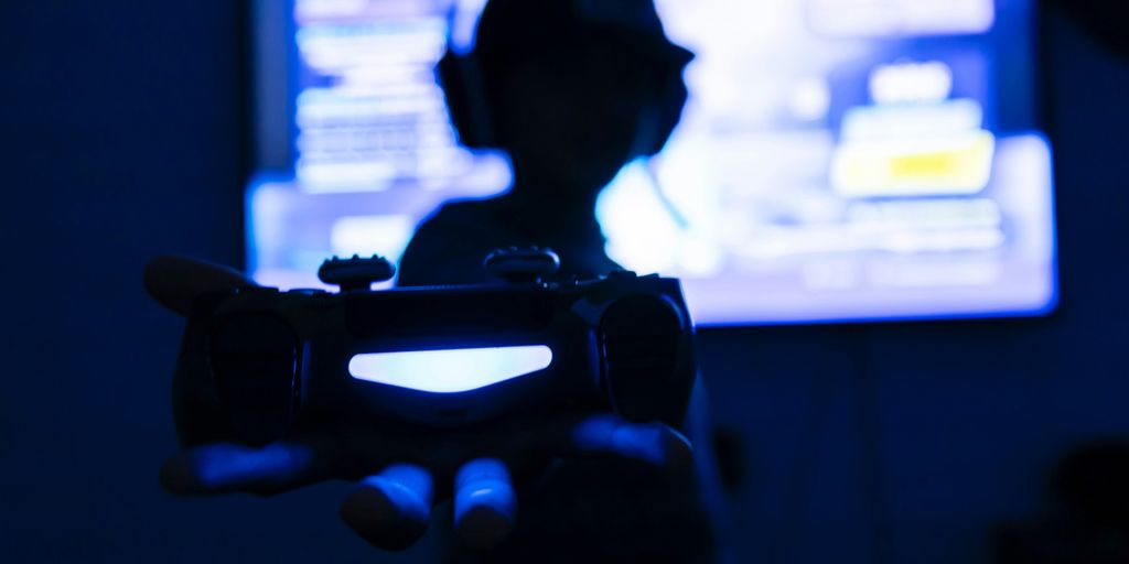 silhouette of man holding camera