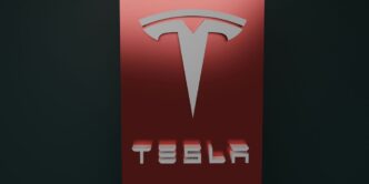 a red tesla logo on a black background