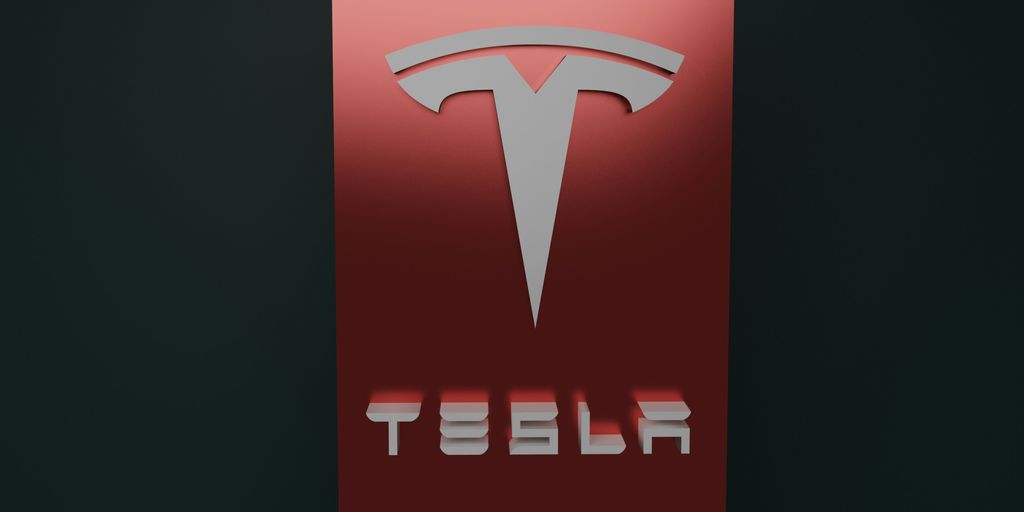 a red tesla logo on a black background