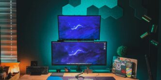 black flat screen computer monitor on brown wooden desk
