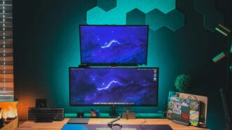 black flat screen computer monitor on brown wooden desk